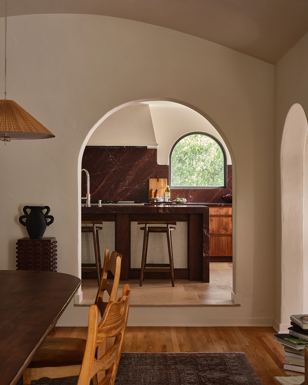 arched doorway view into kitchen