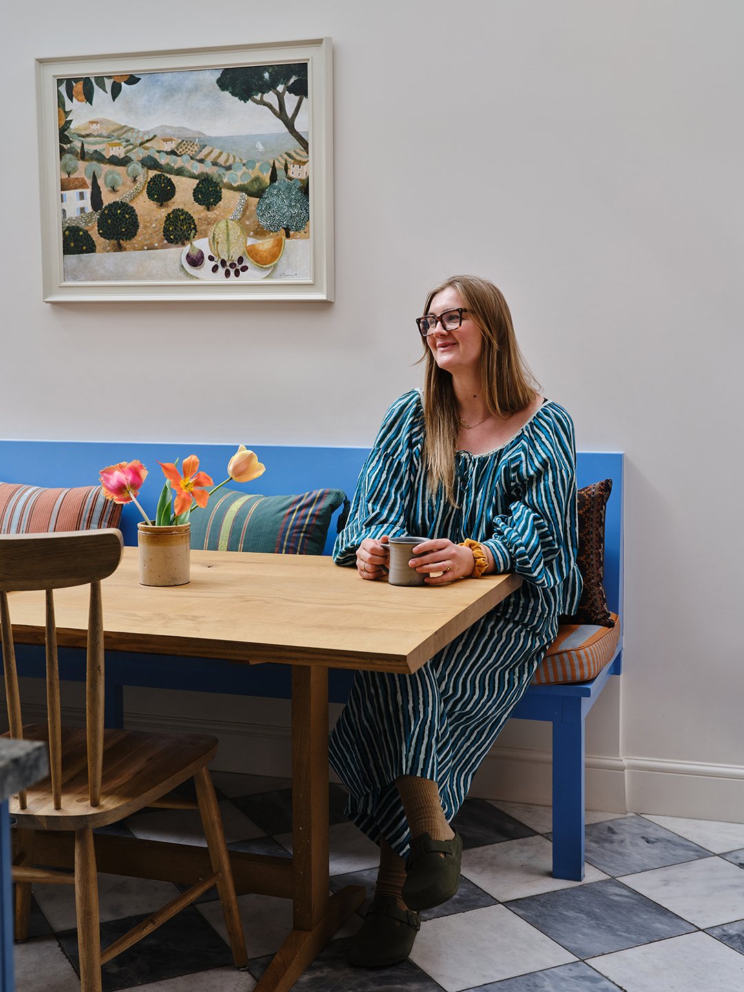 woman sitting on banquette