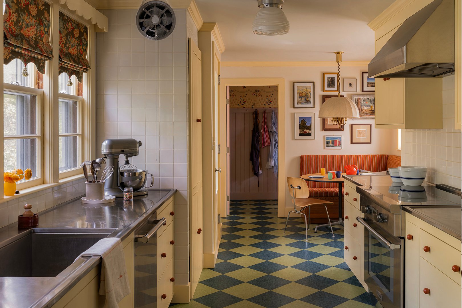 yellow kitchen with checkered floors