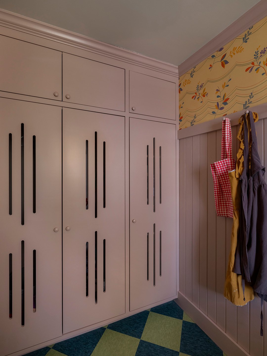 laundry room with purple cabinets