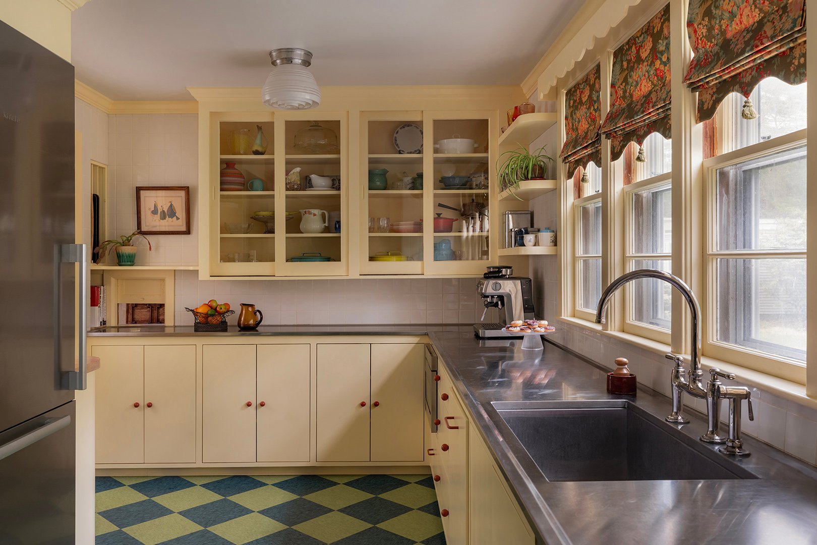 yellow kitchen with stainless steel counters