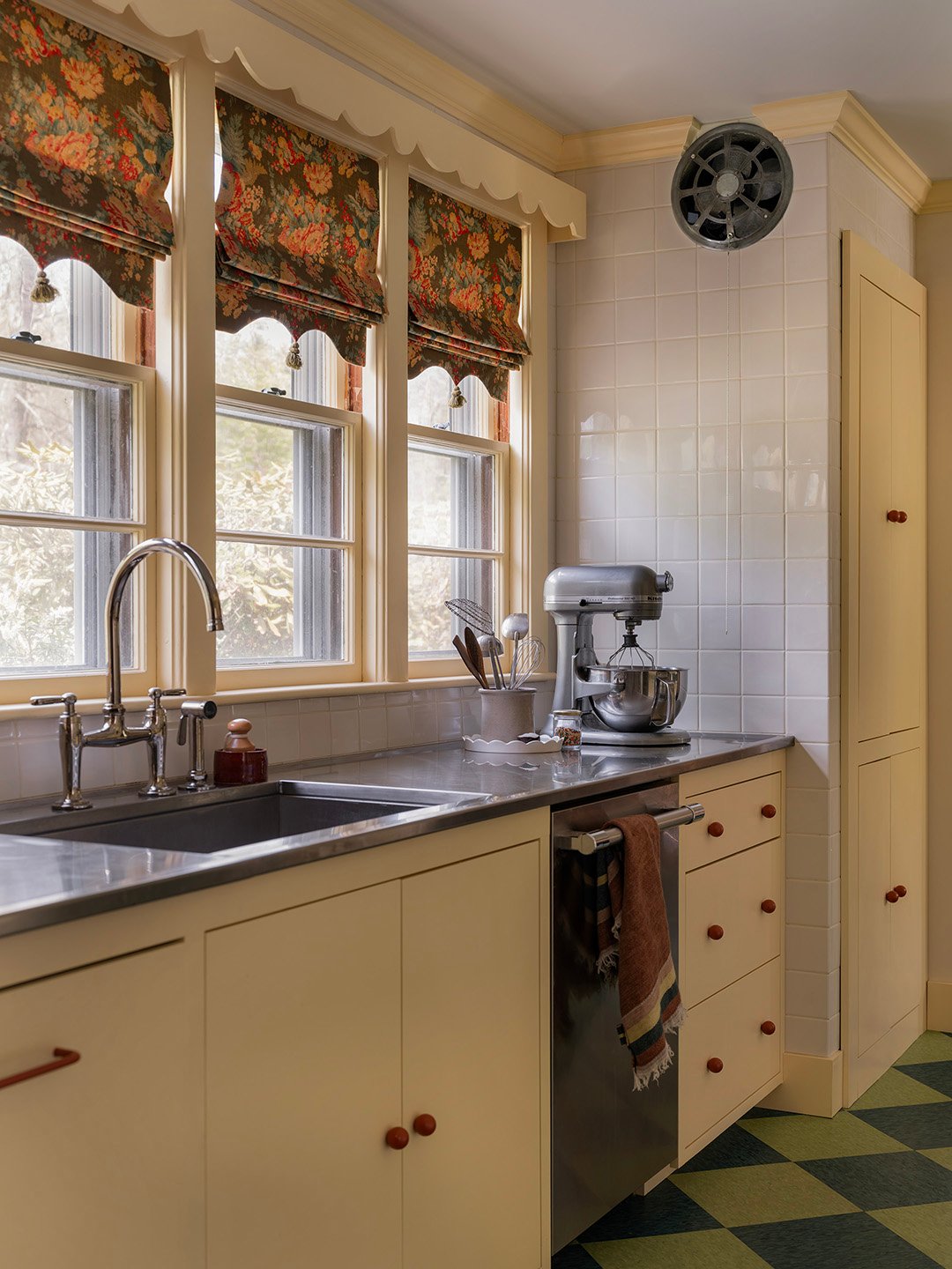 yellow kitchen with checkered floors