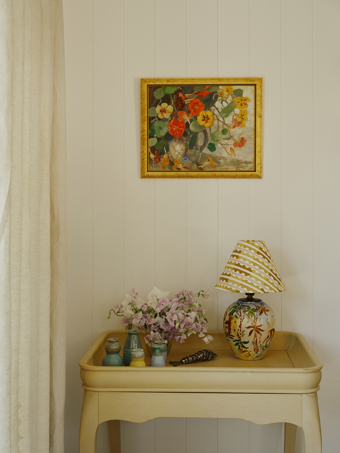 side table with painting above