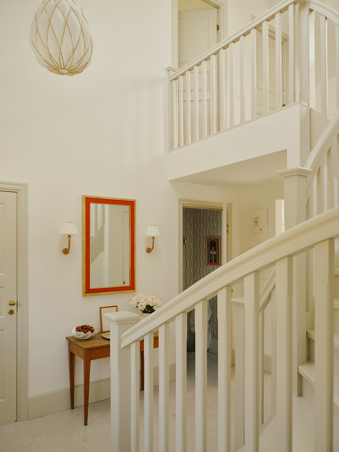 white foyer with white stairs