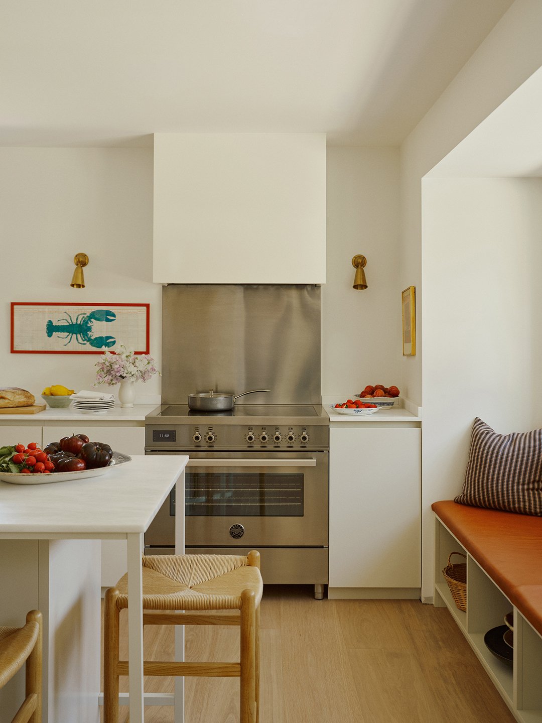 white kitchen with stainless steel range