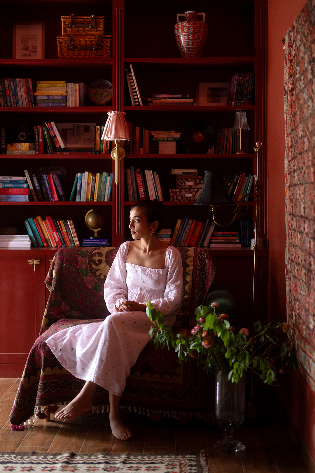 Vaishnavi sitting in her red library