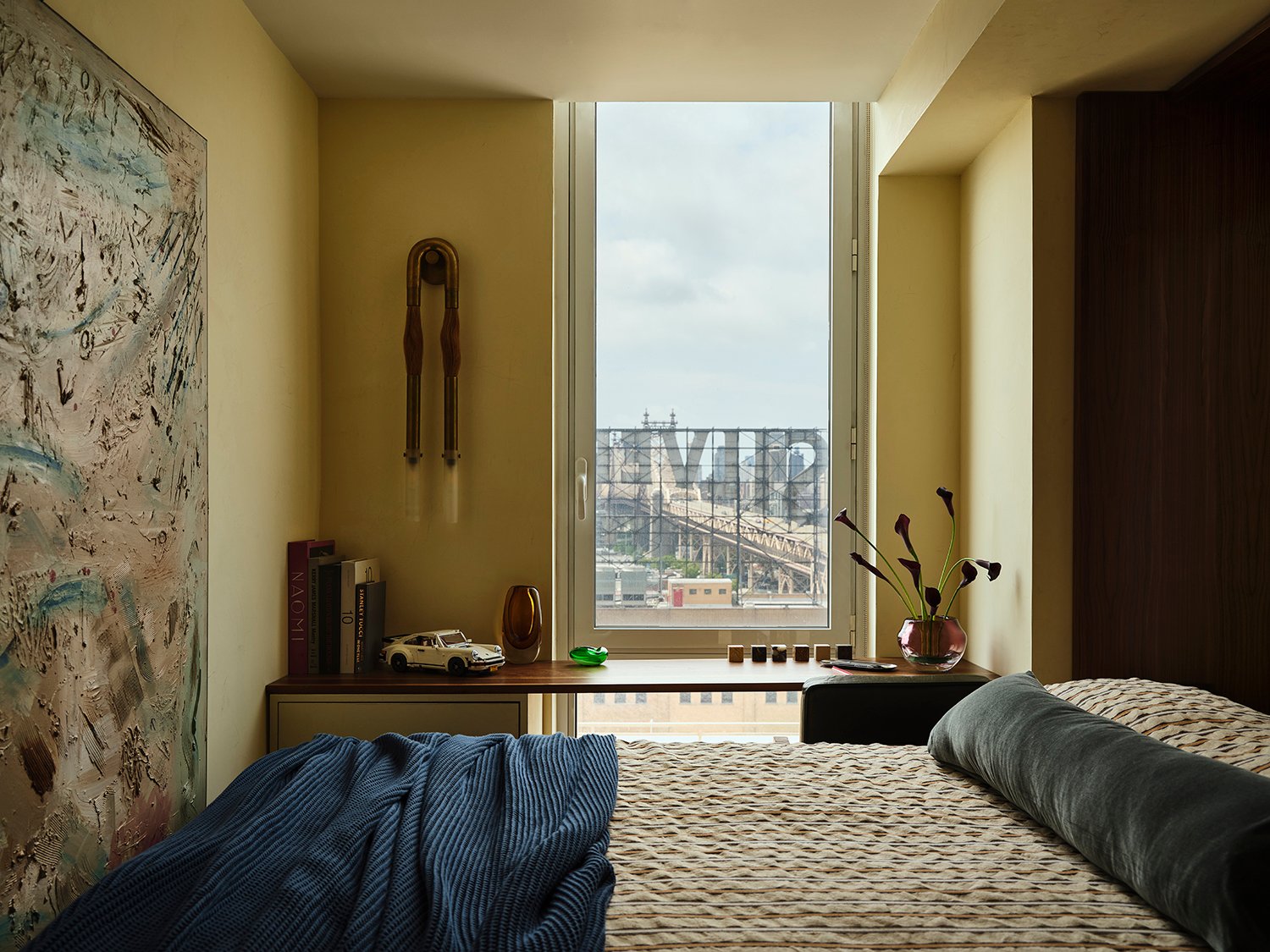 murphy bed with gray lumbar pillow