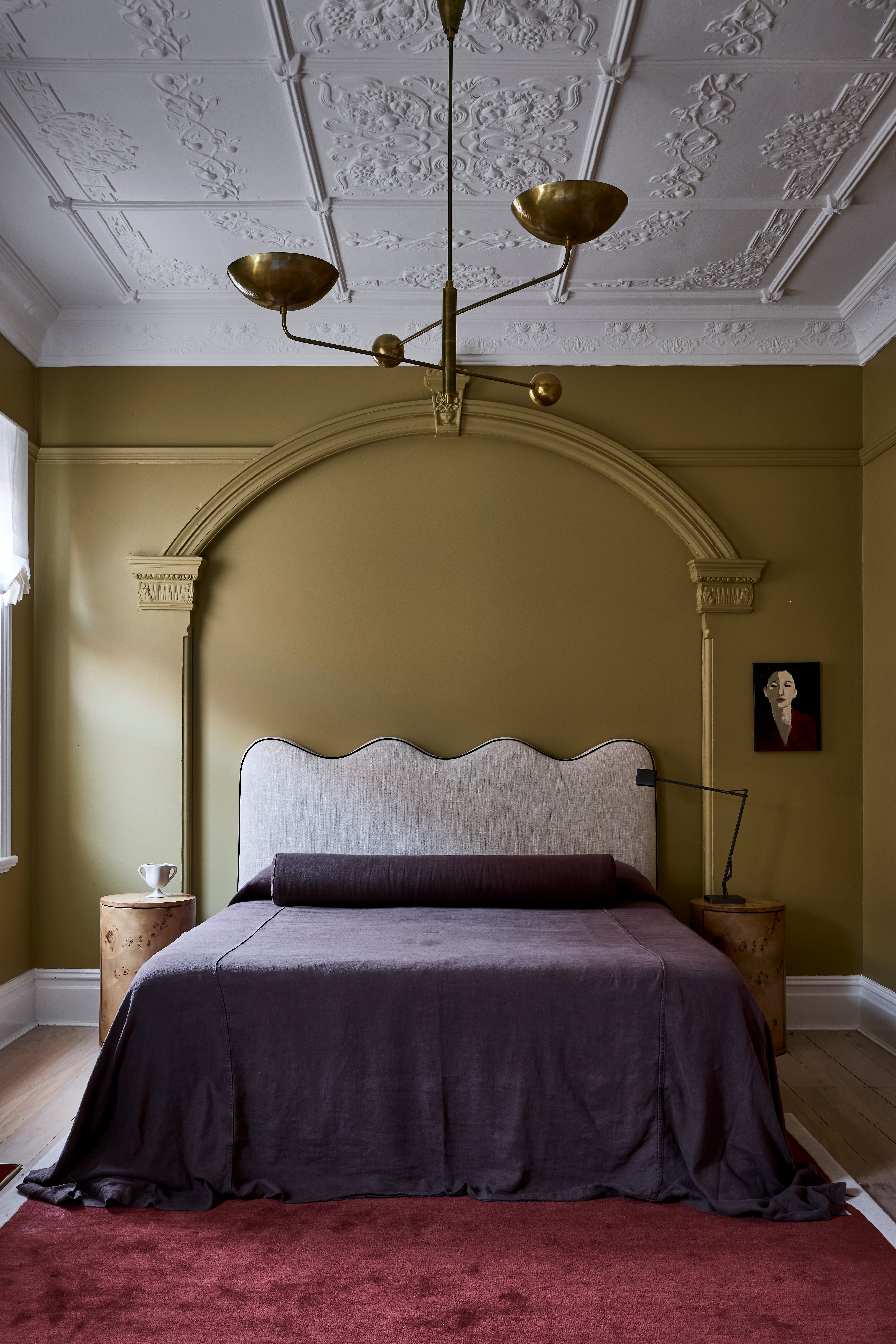purple bed with matching bolster pillow