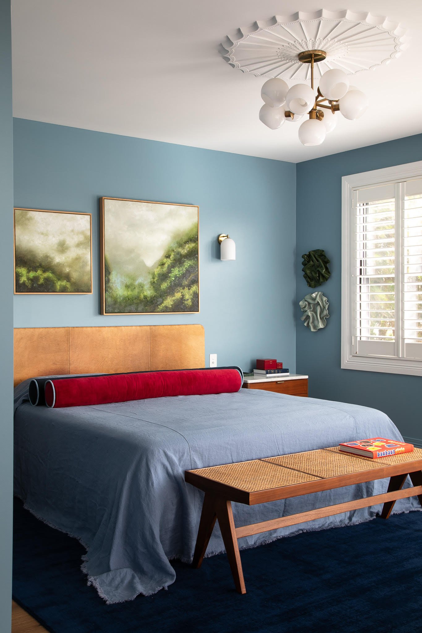 bed with two bolster pillows