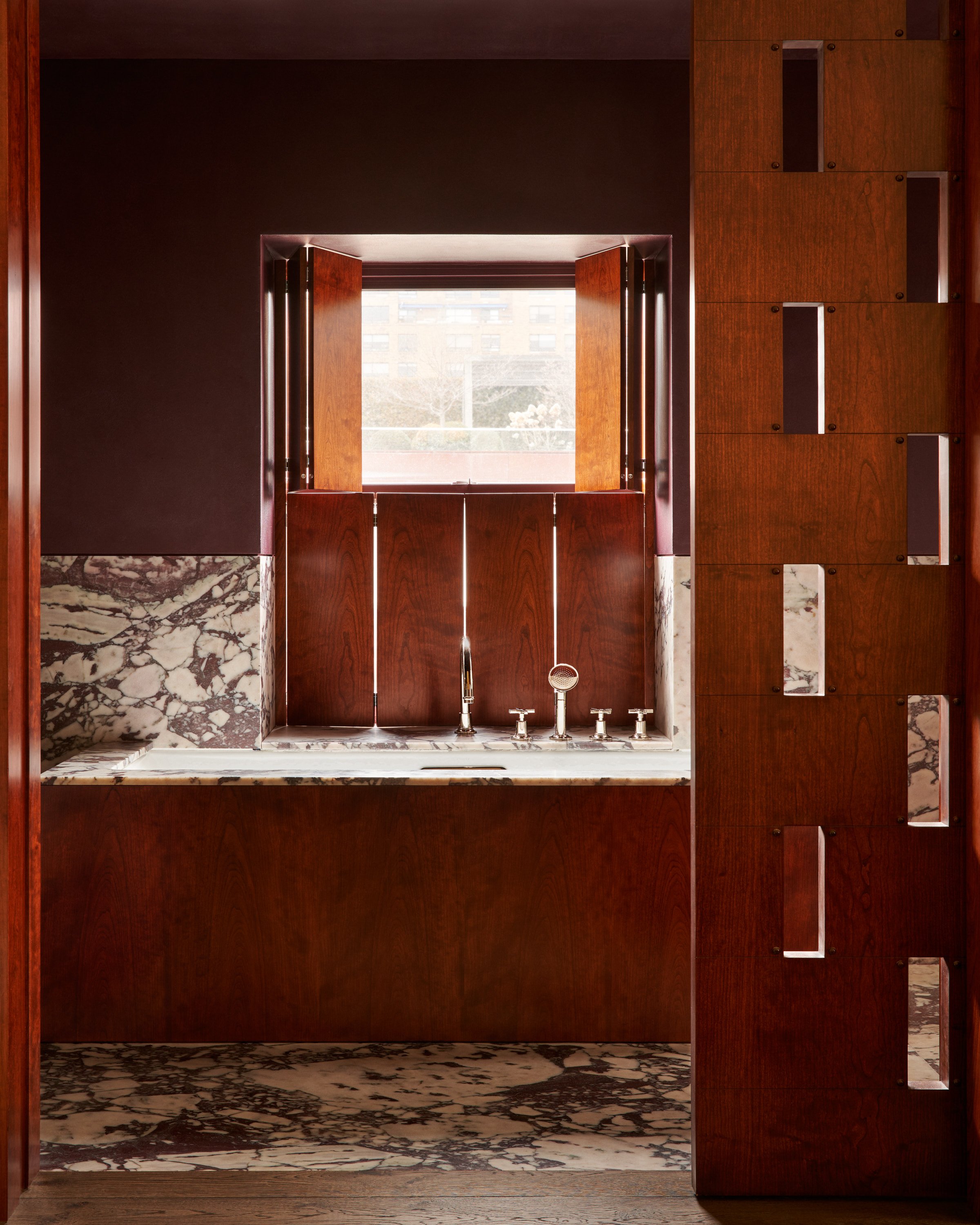 cheery wood and marble bathtub
