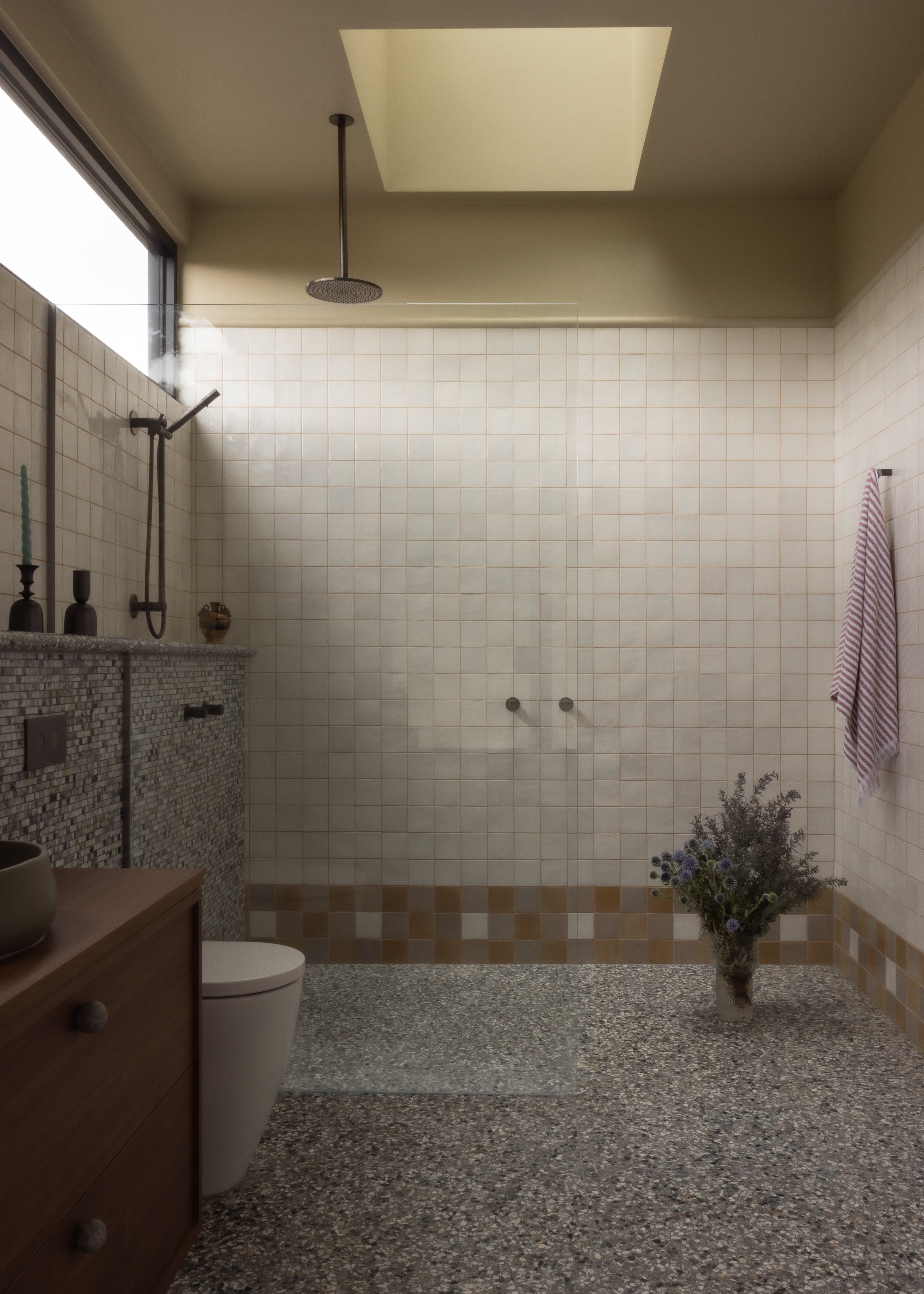 neutral bathroom with geometric tile baseboards