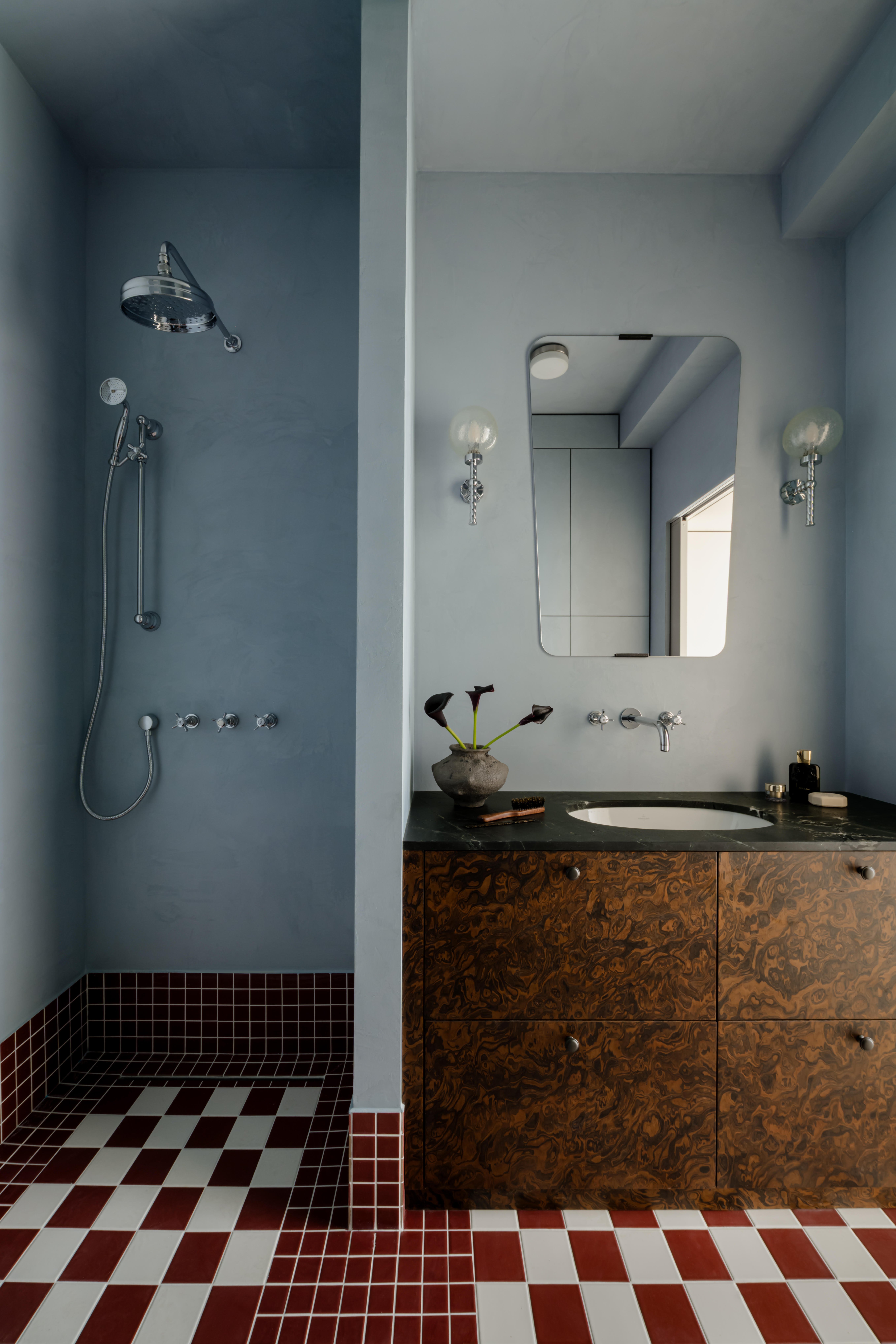 blue bathroom with red checkered floors