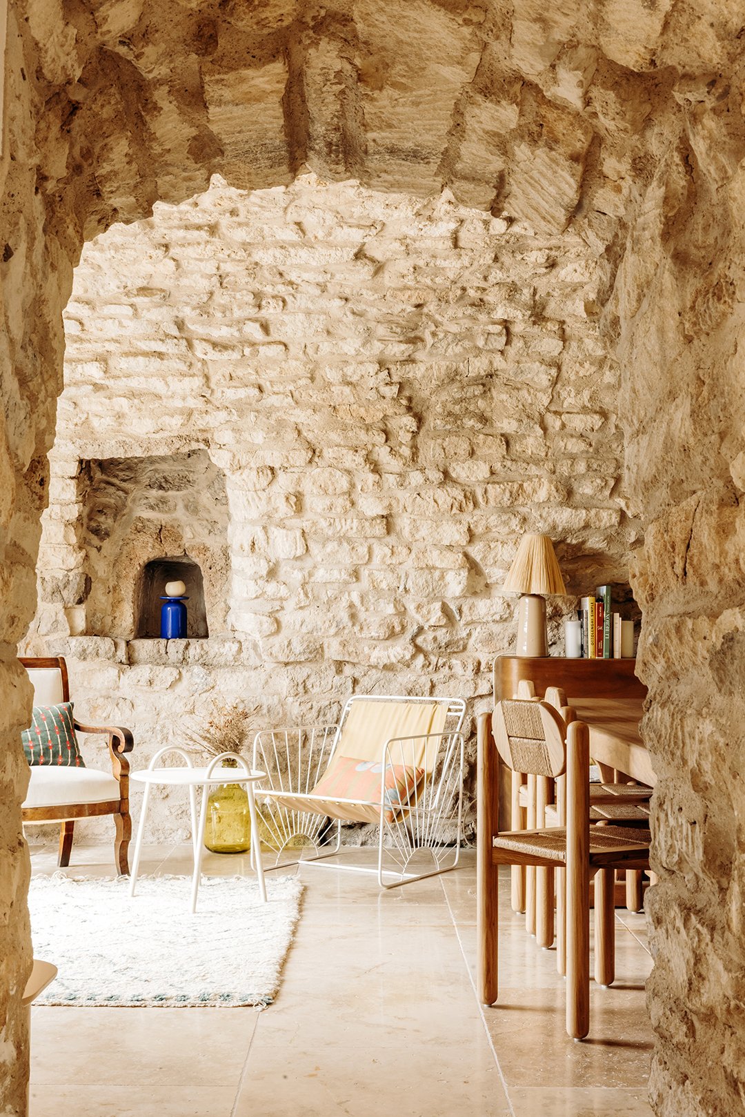 interior of a stone walled house with chairs
