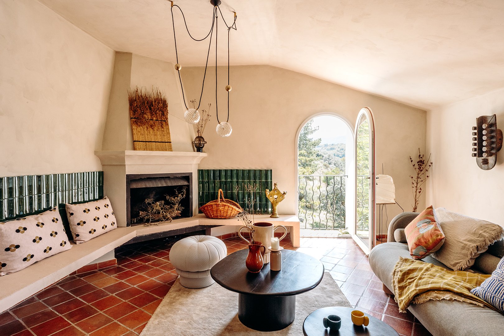 living room with green tile by fireplace