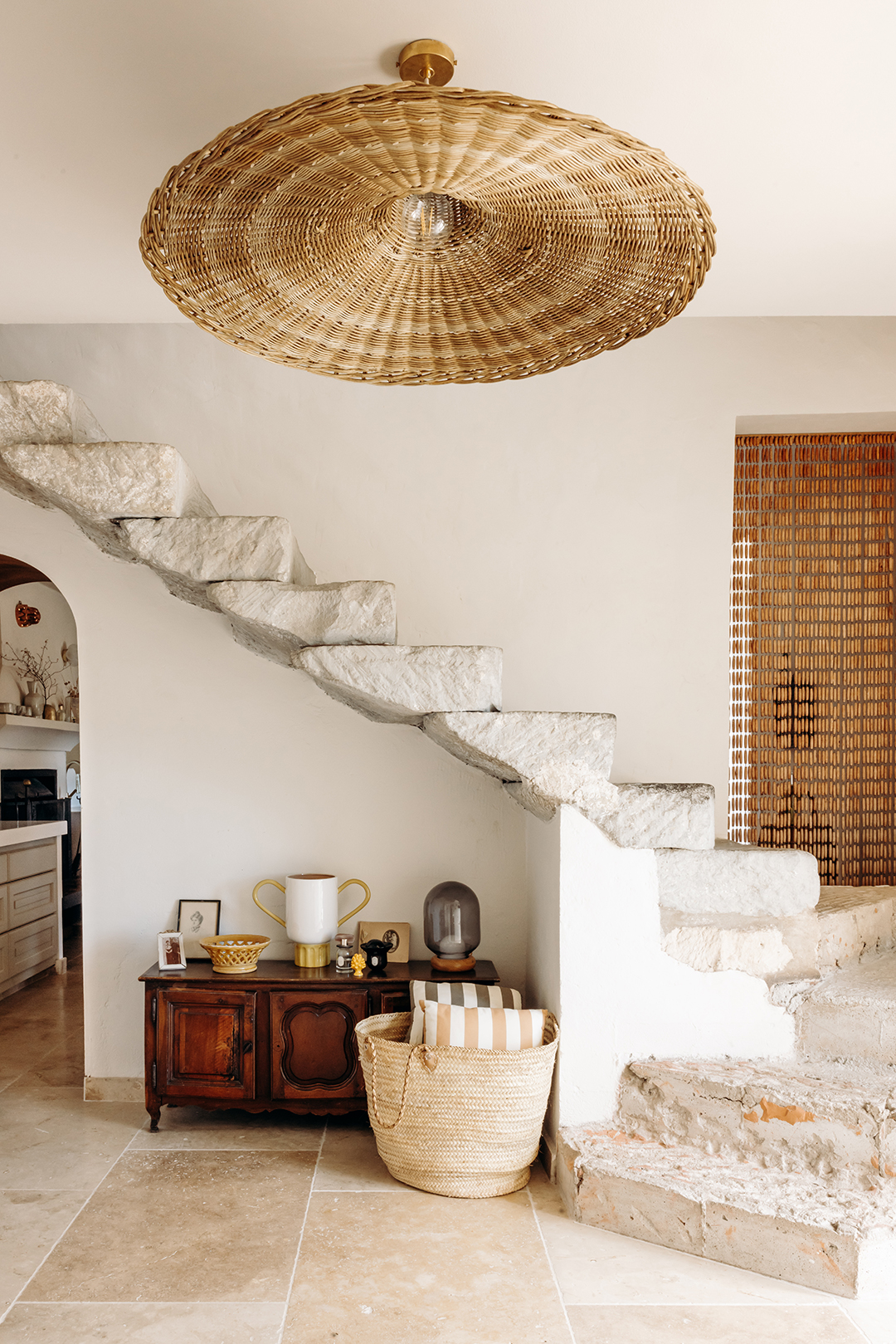stone staircase open to a white room