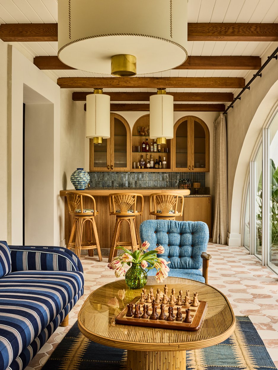 florida room with arched windows and blue accents