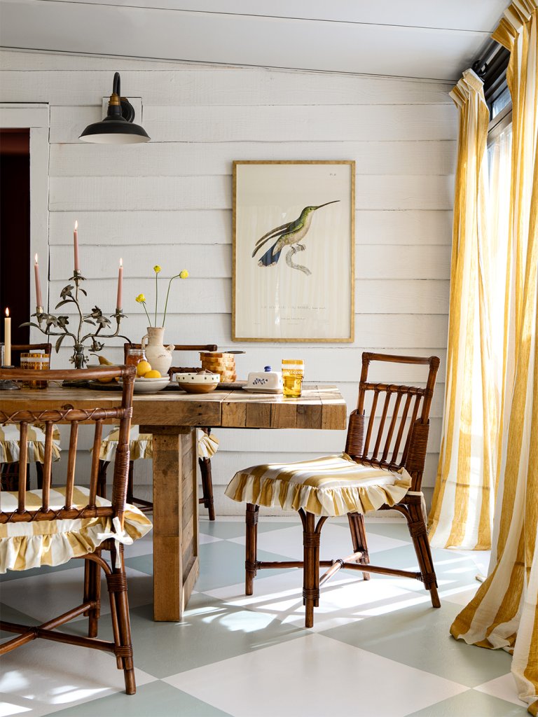 white dining room with yellow striped chairs