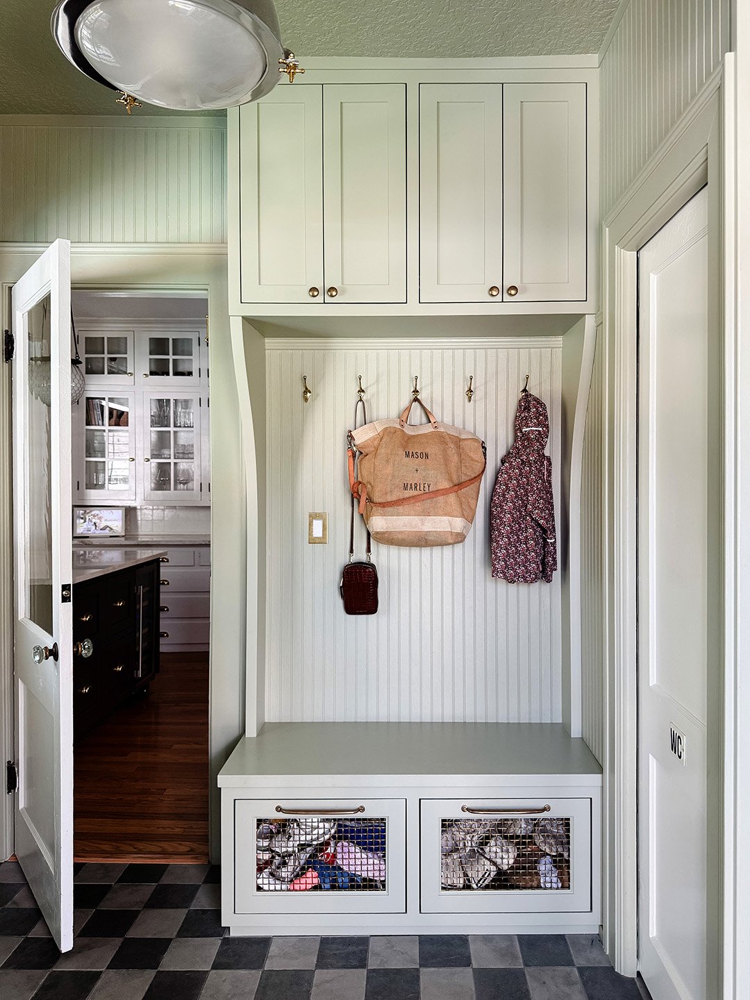 sage green mudroom shoe drawers