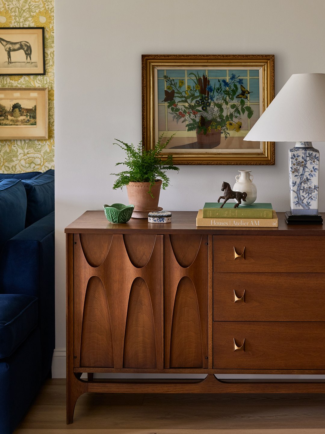 wood sideboard and artwork