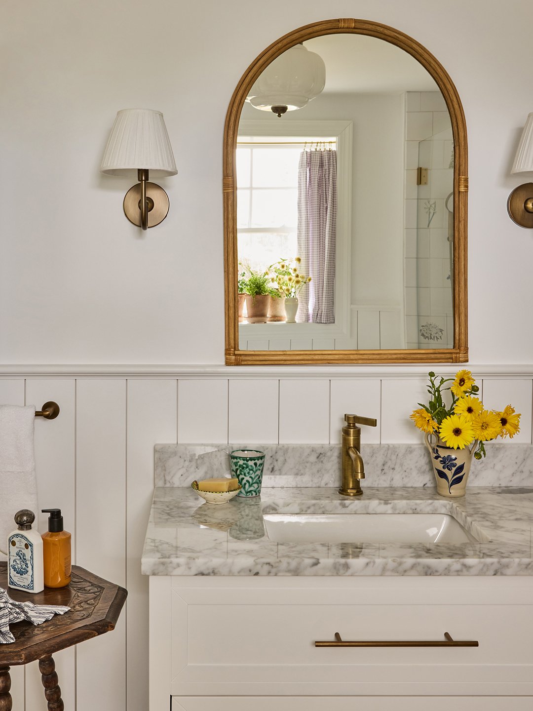 white bathroom with marble topped vanity