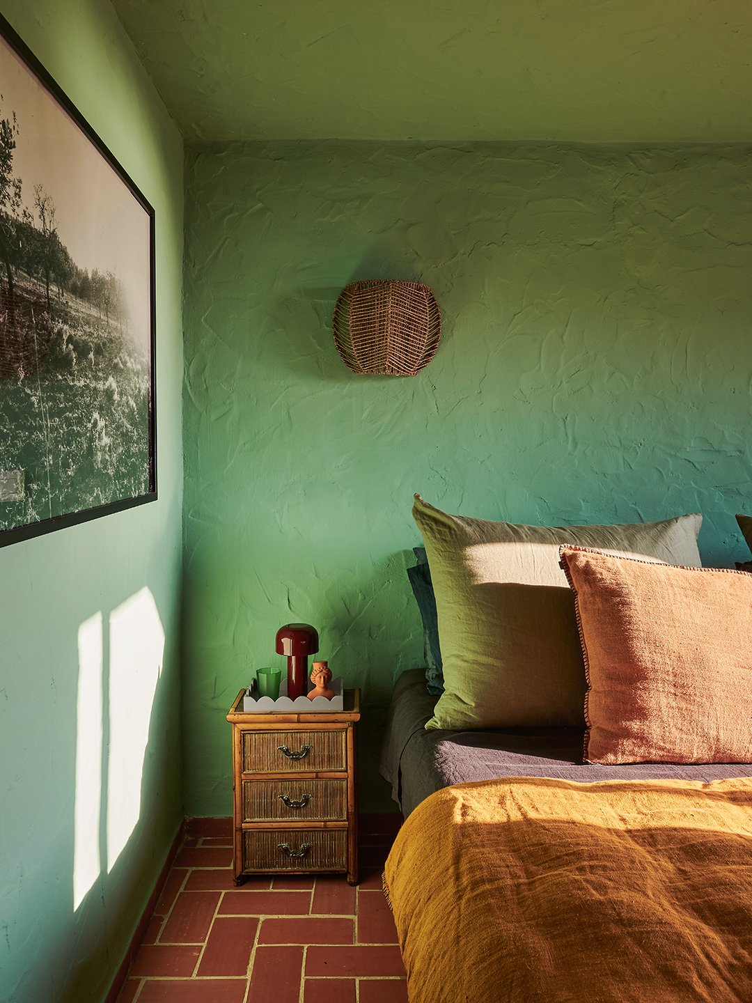bedroom with green plaster walls