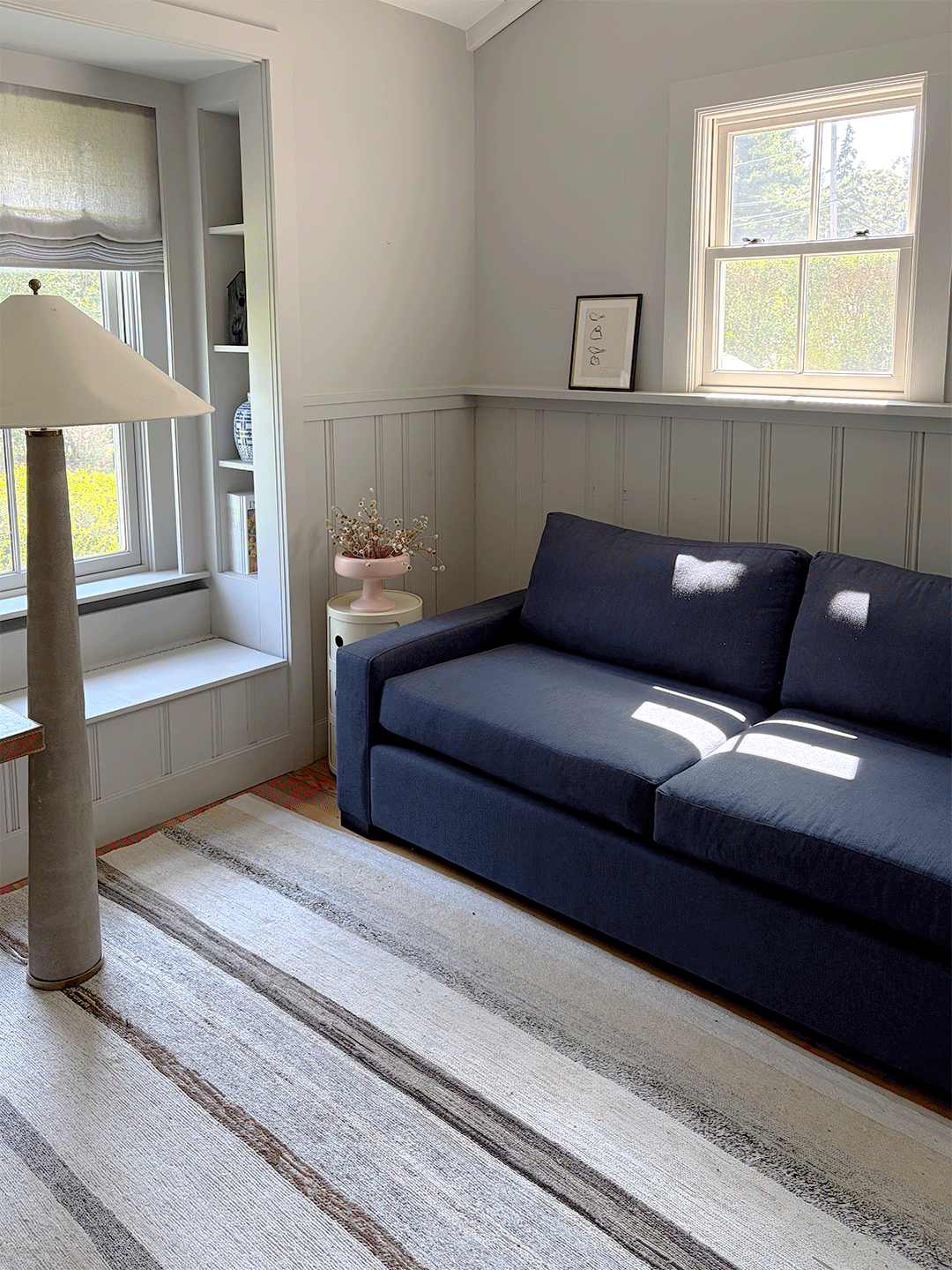 blue sofa in a gray room