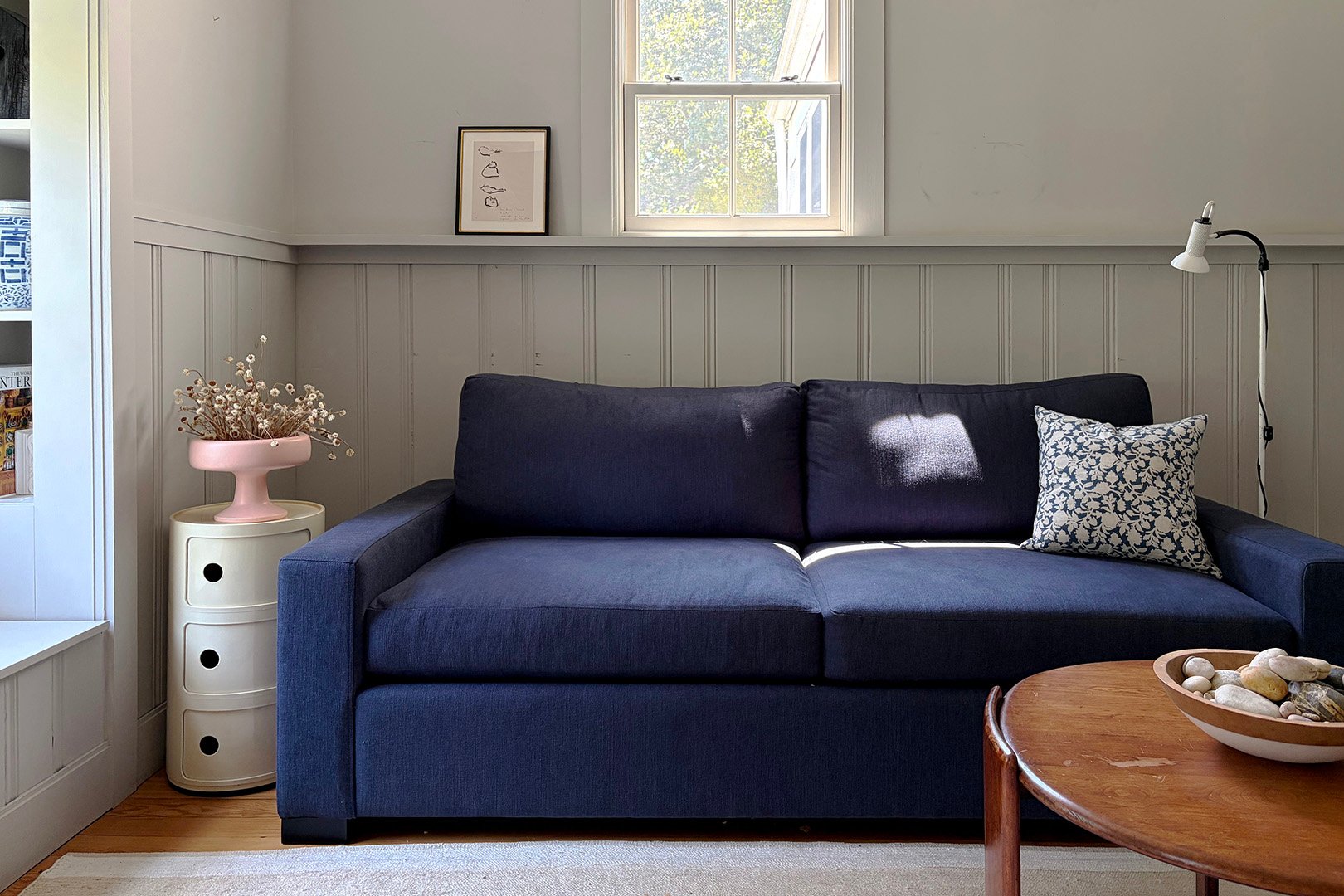 blue sofa in a gray room