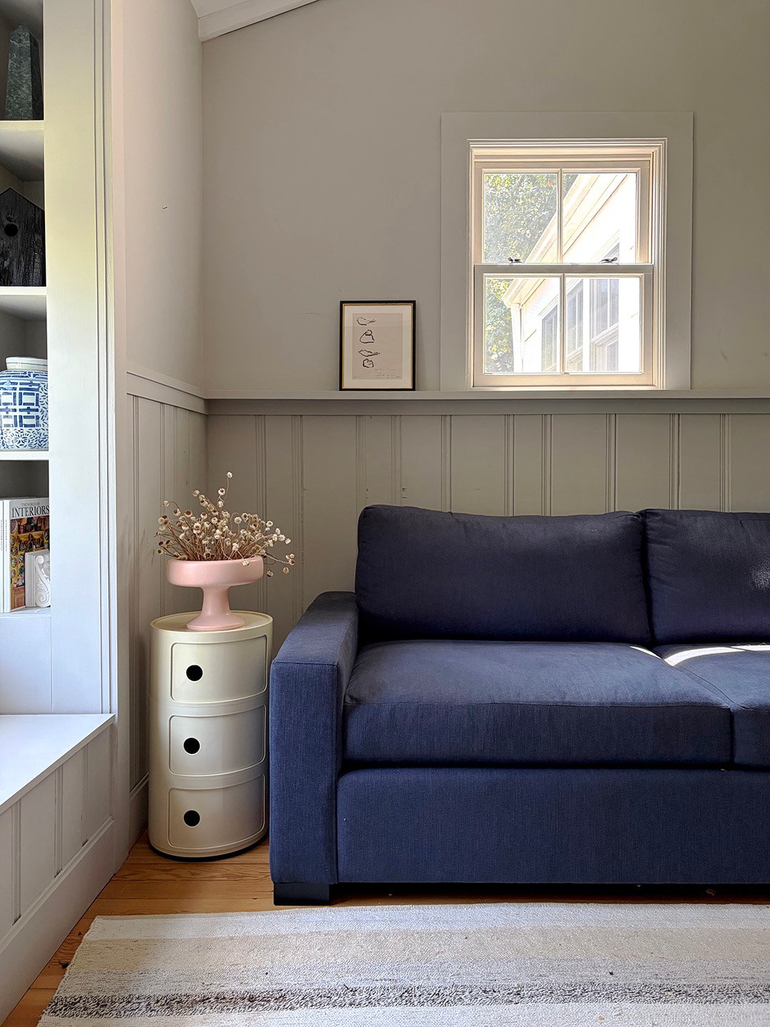 blue sofa in a gray room