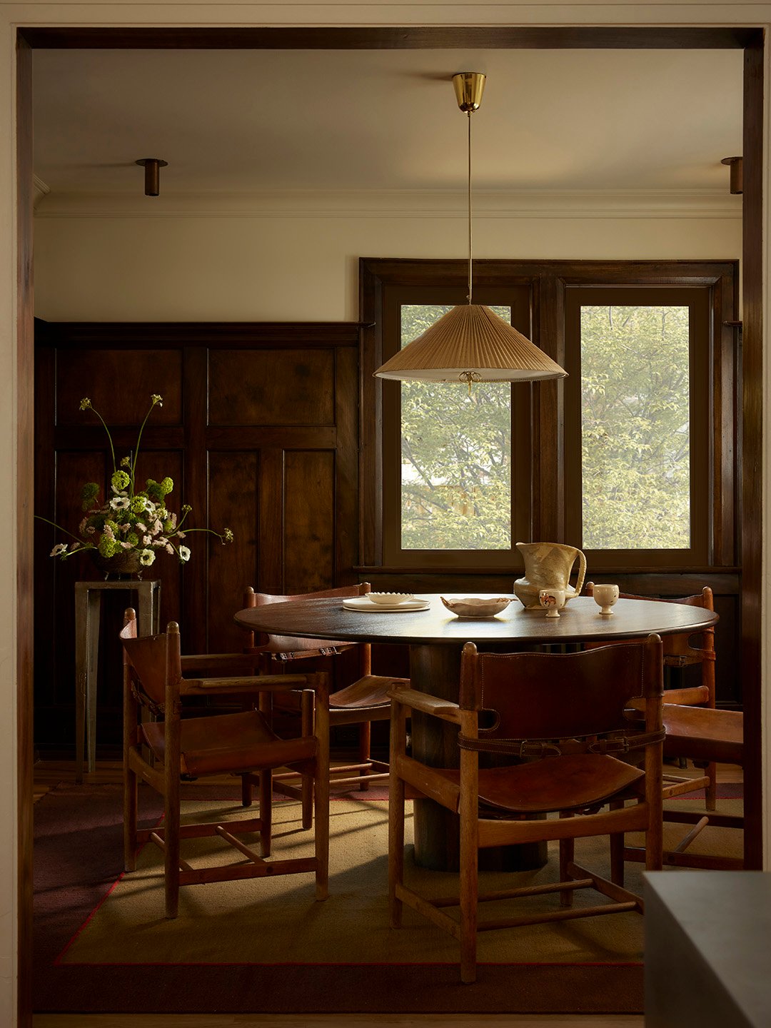 dining room with dark paneling