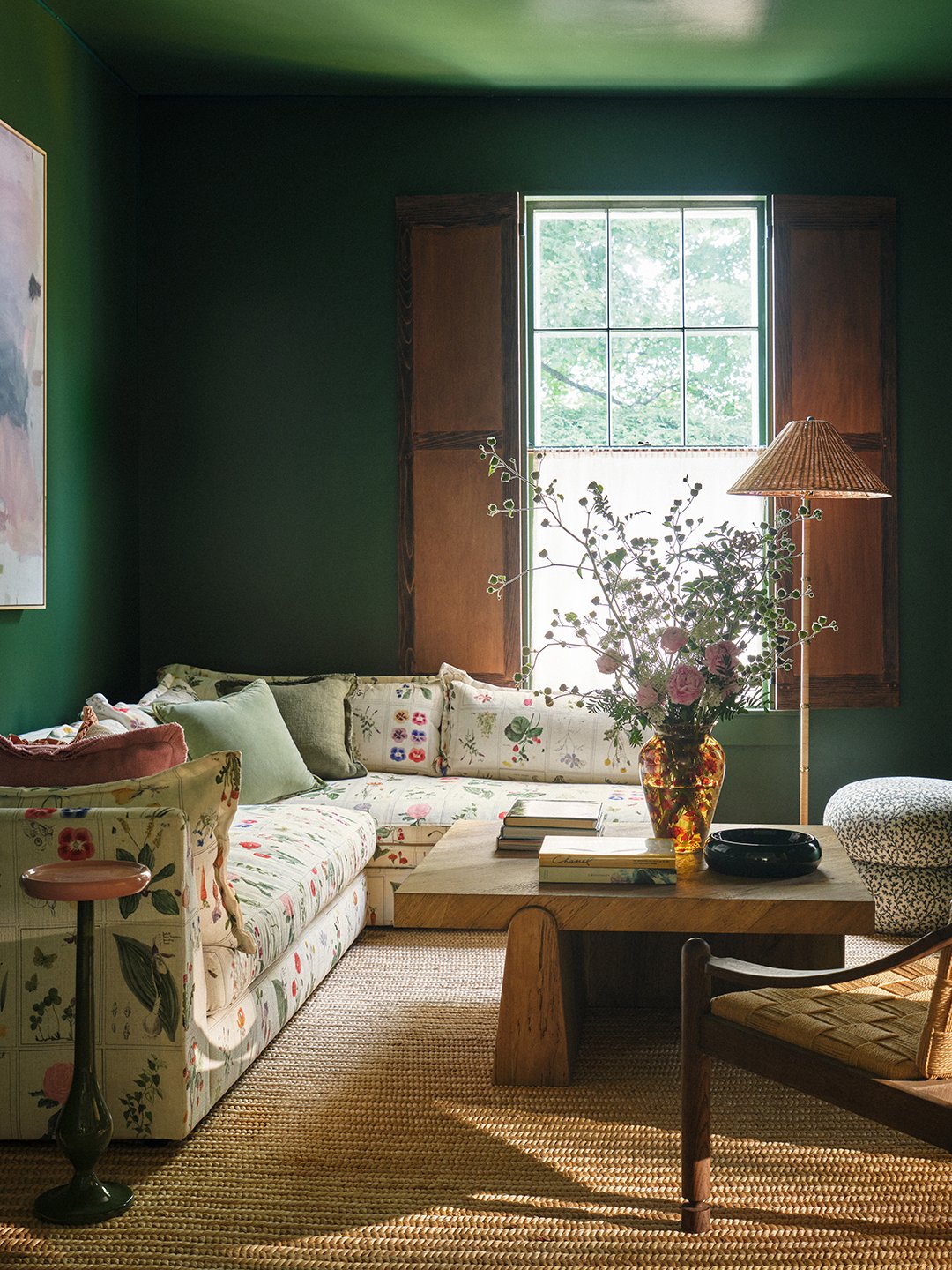 green living room with floral sectional