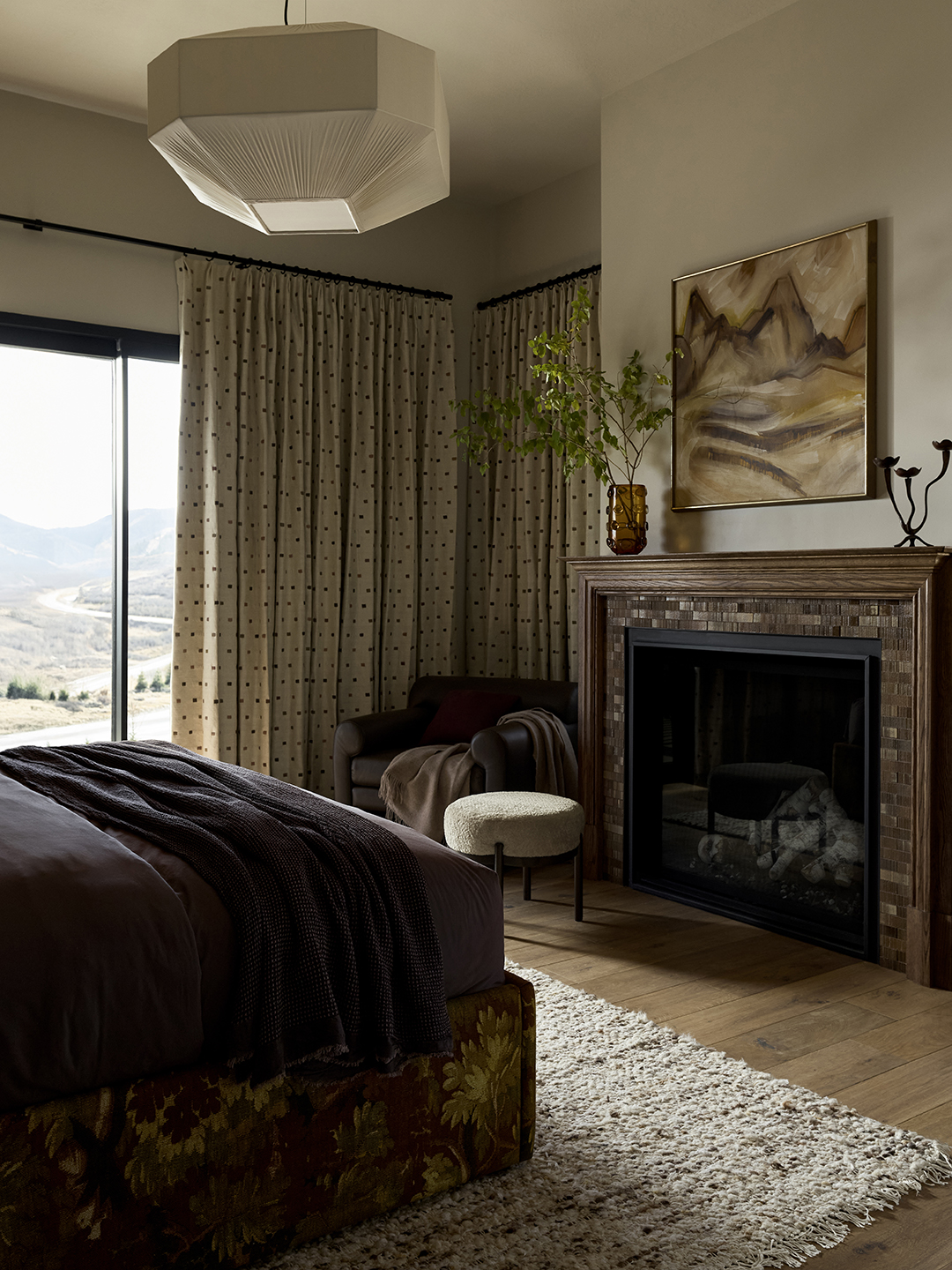 moody brown tile bedroom fireplace