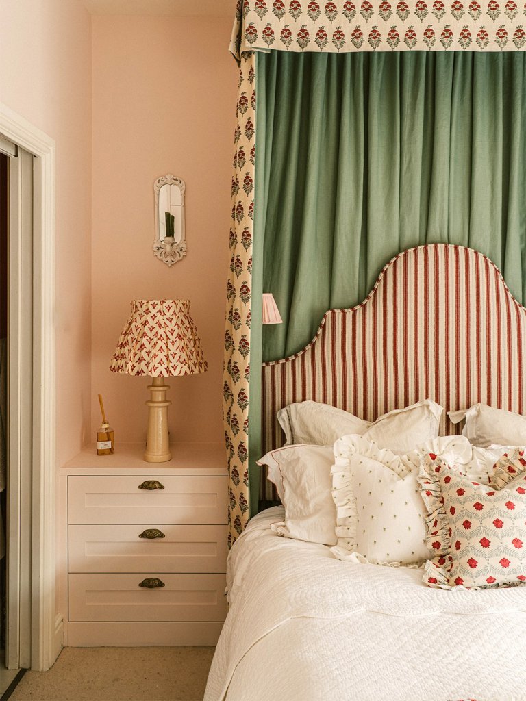 bedroom with striped headboard