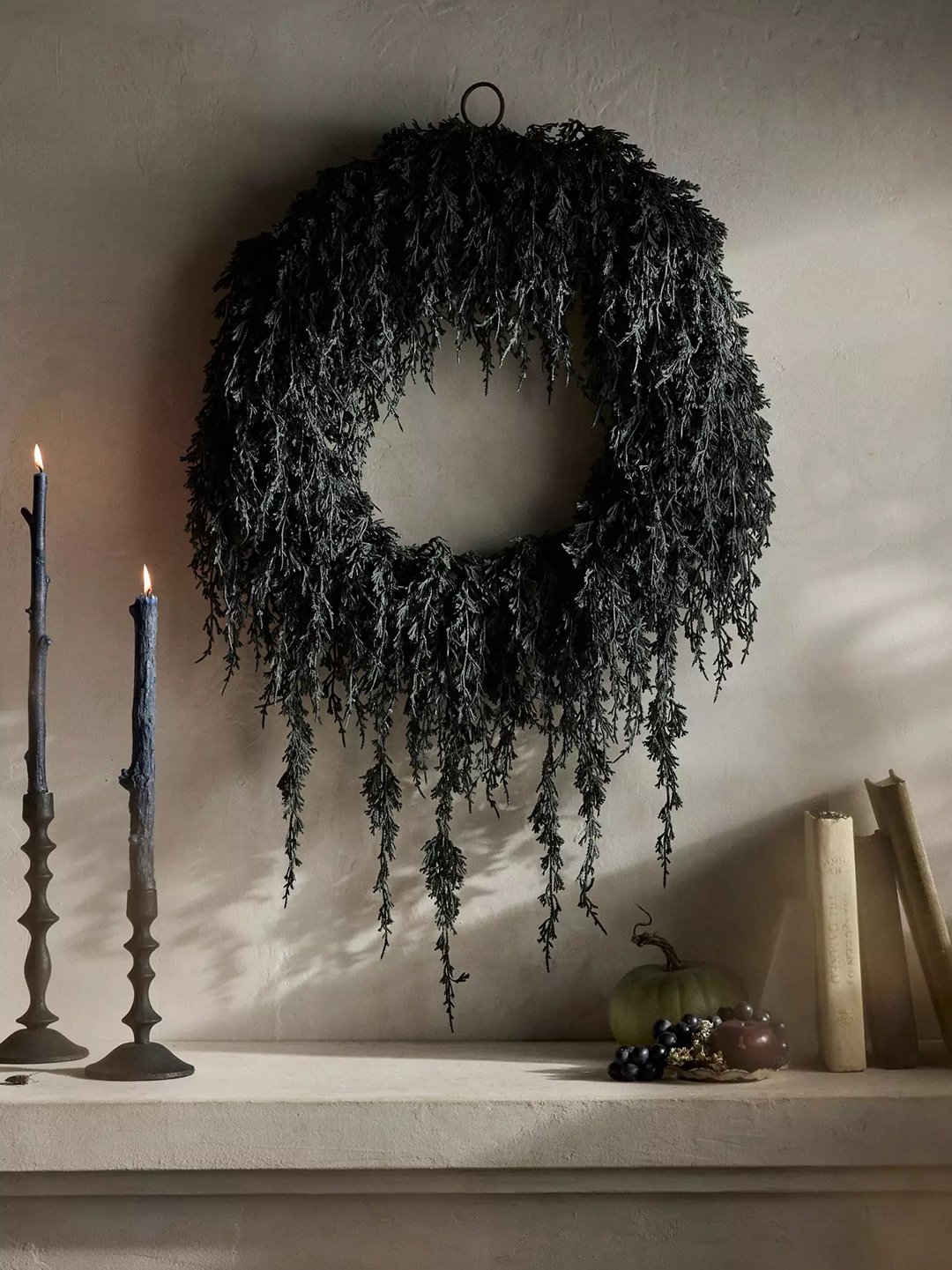 black wreath on mantel