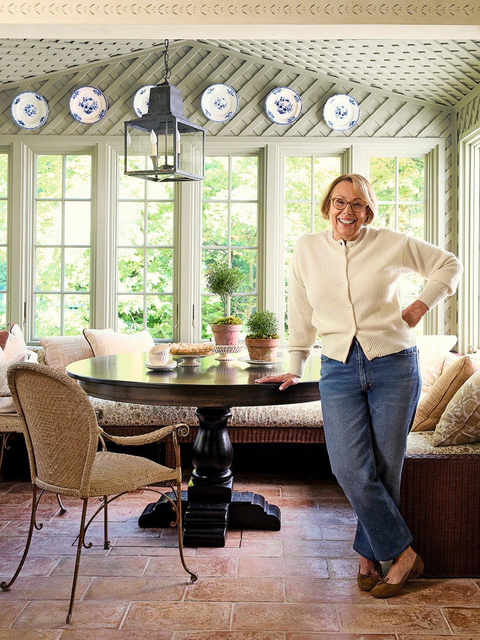 woman leaning on a dining room table