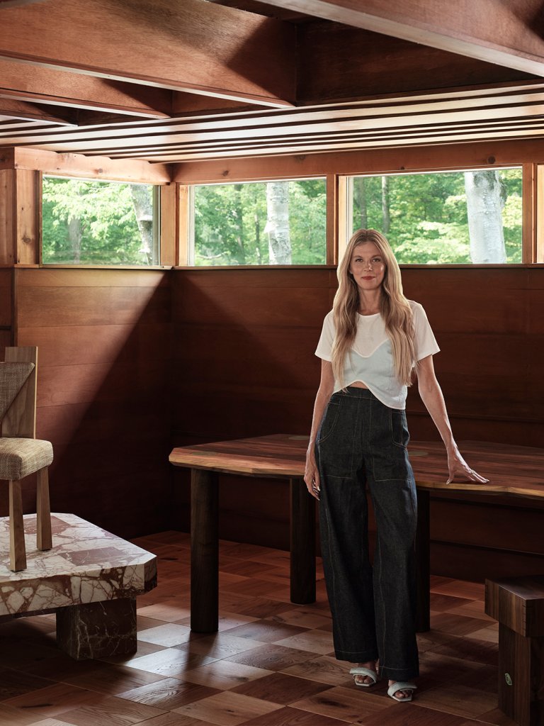 woman leaning on table