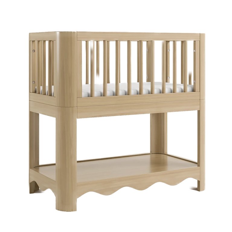 Wood bassinet with bottom shelf featuring curvy detail.