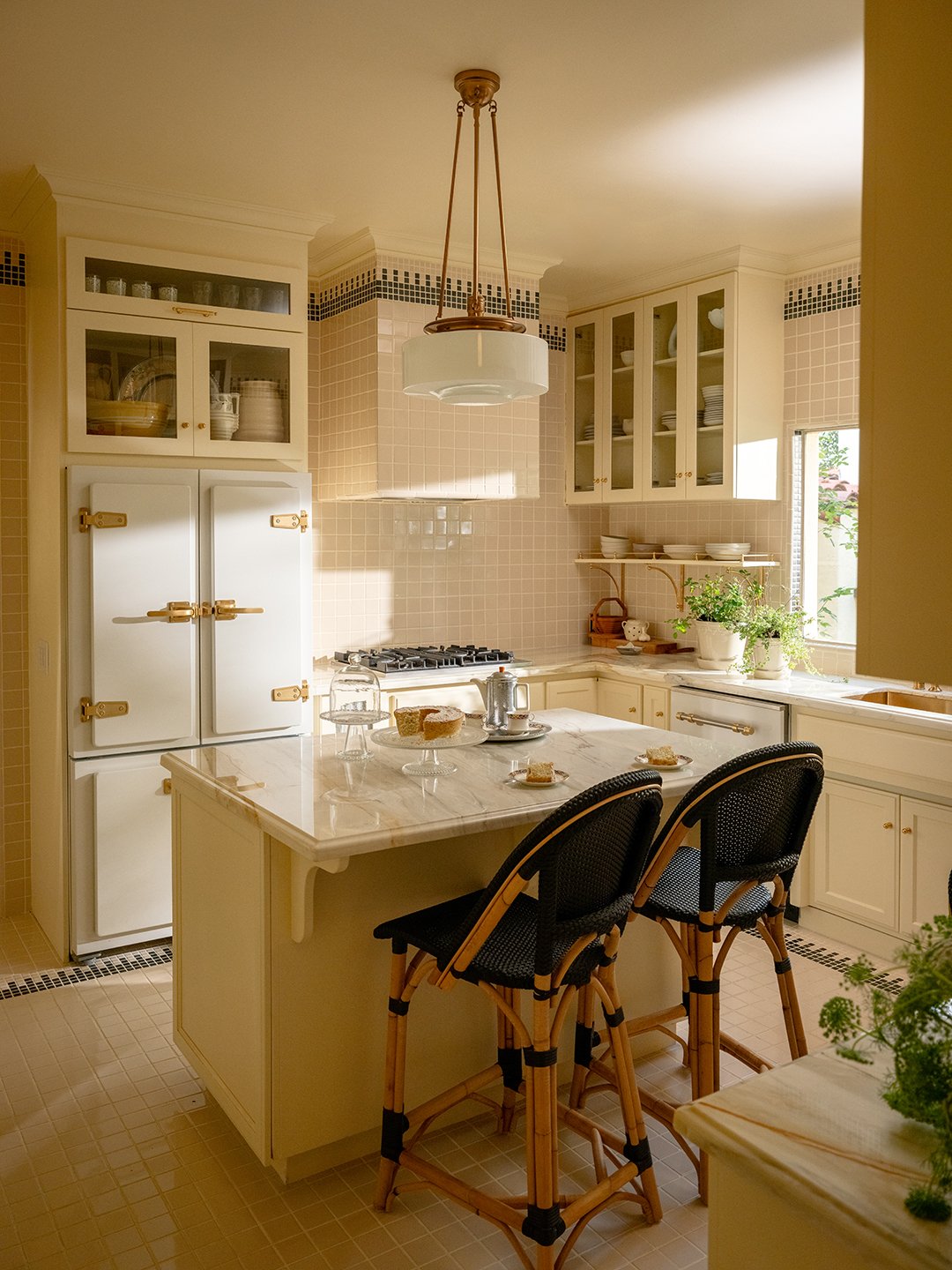 kitchen with cream tiles and cabinets