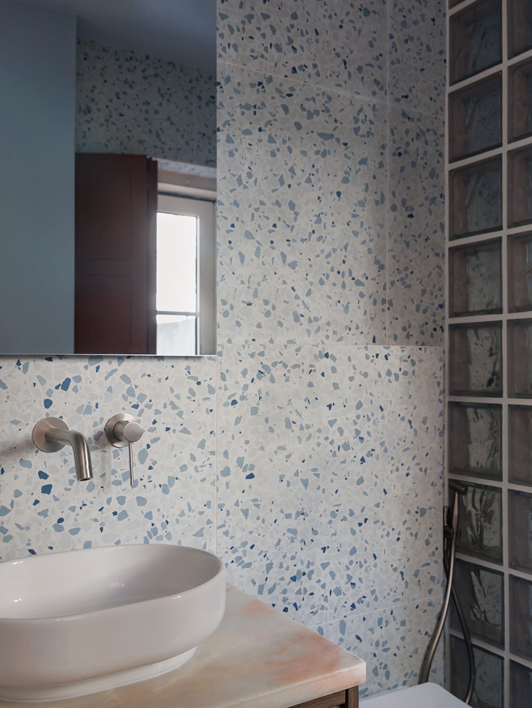 bathroom with terrazzo wall