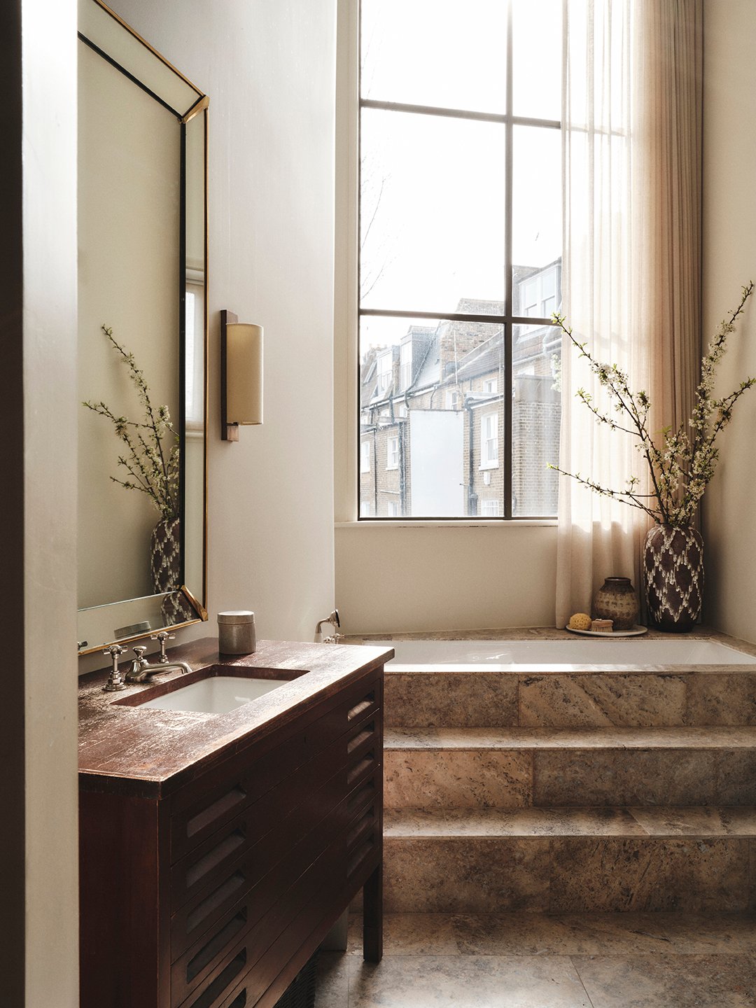 bathroom with steps into tub