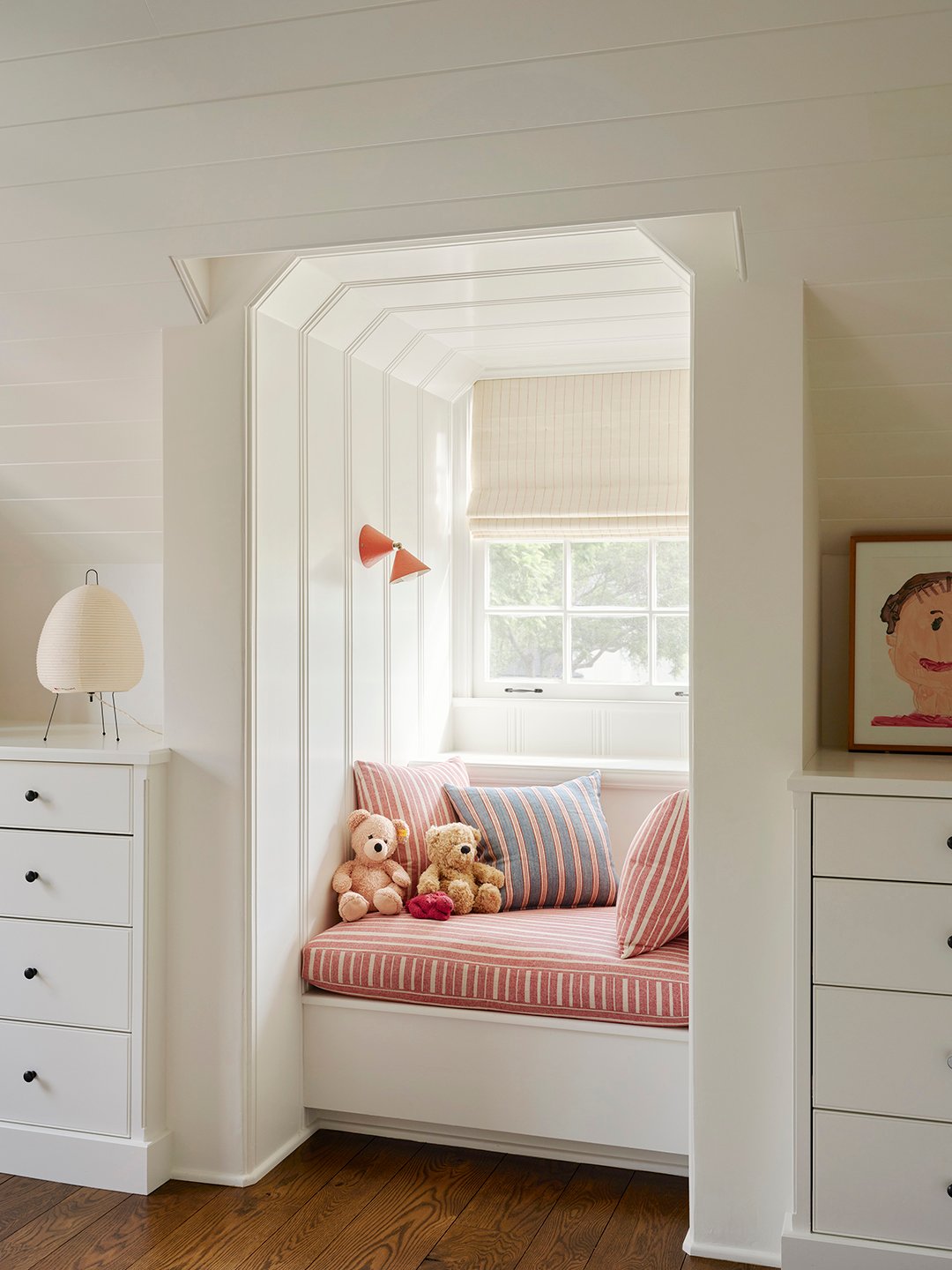 window seat with red cushion