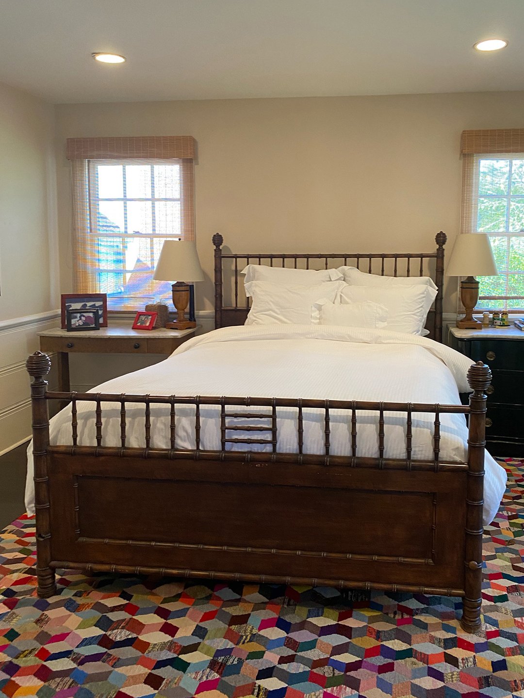 bedroom with a double bed between two windows