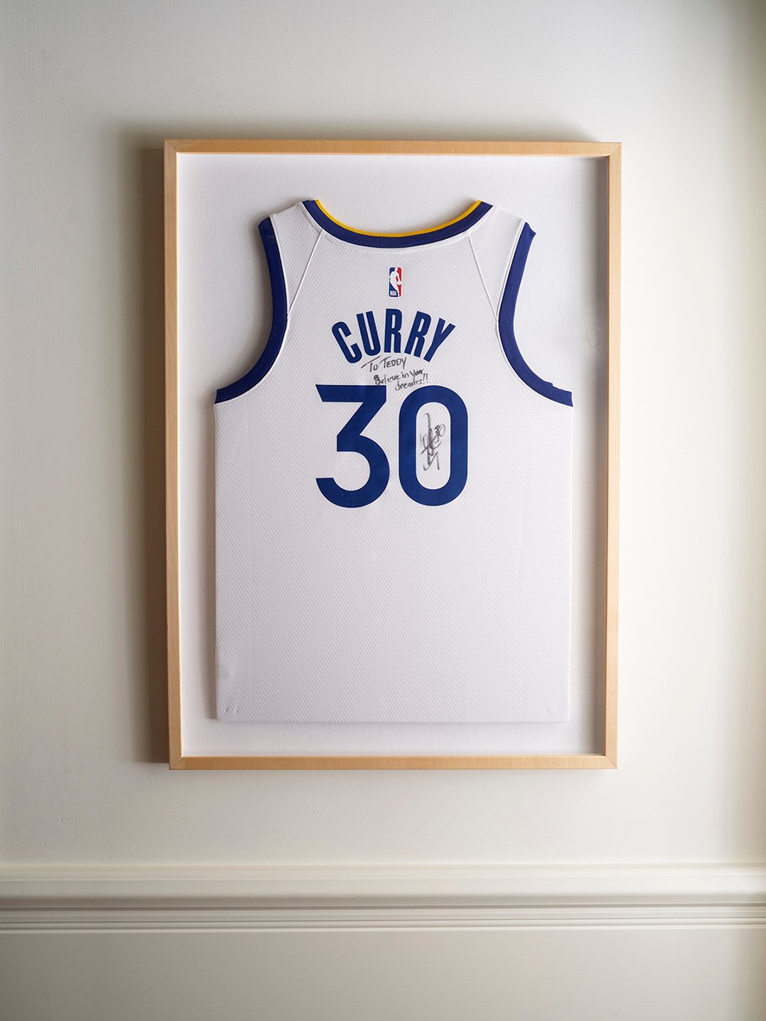 framed basketball jersey with the name Curry