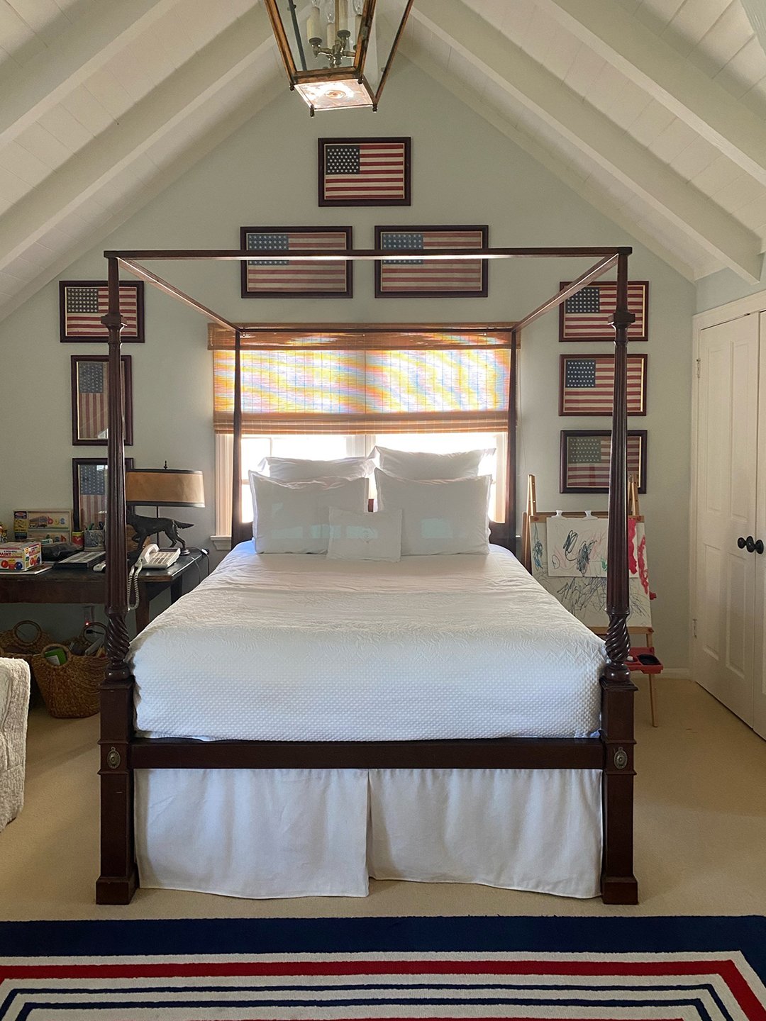 bedroom with vaulted ceiling and canopy bed