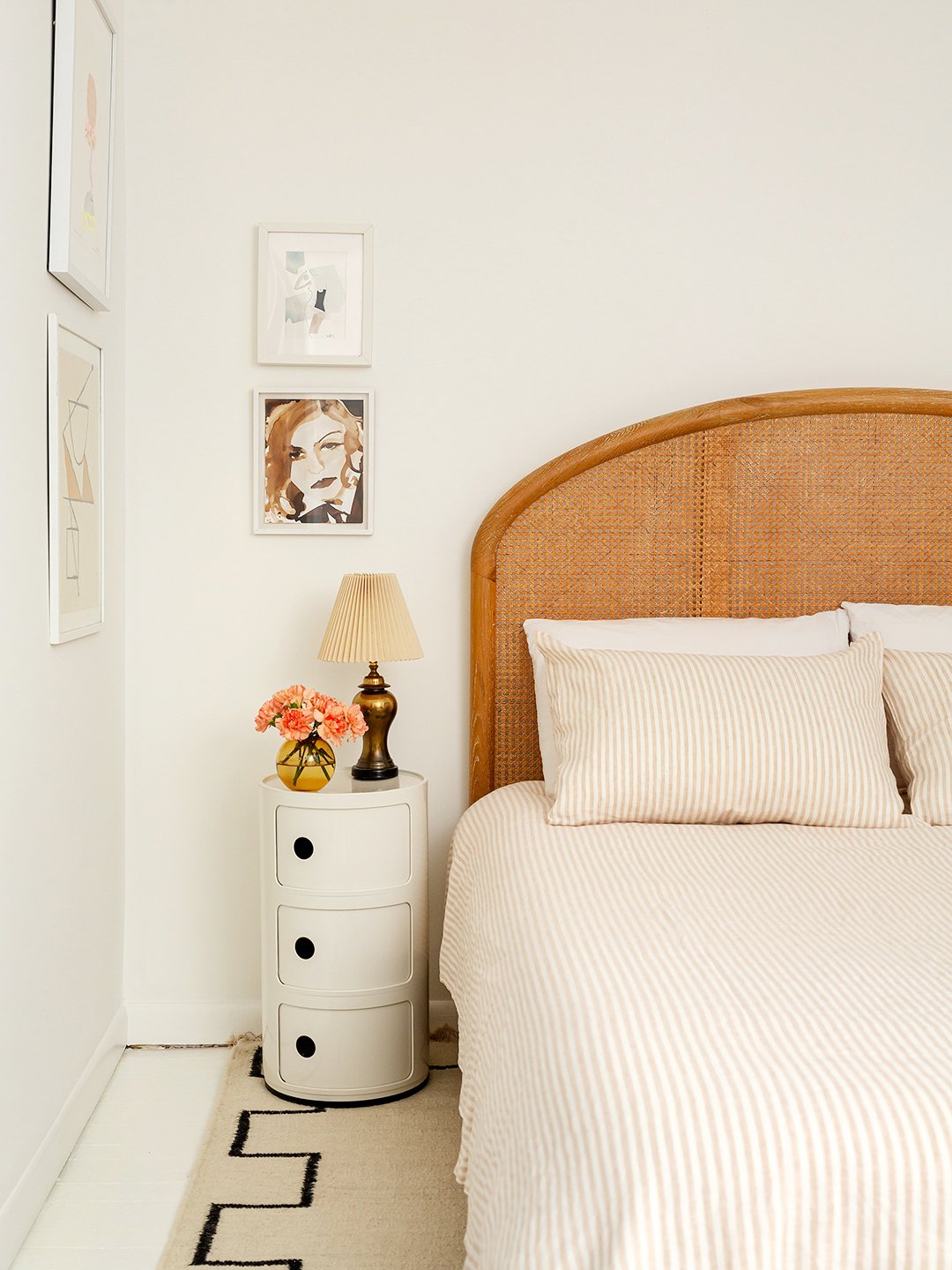 white bedroom with rattan headboard