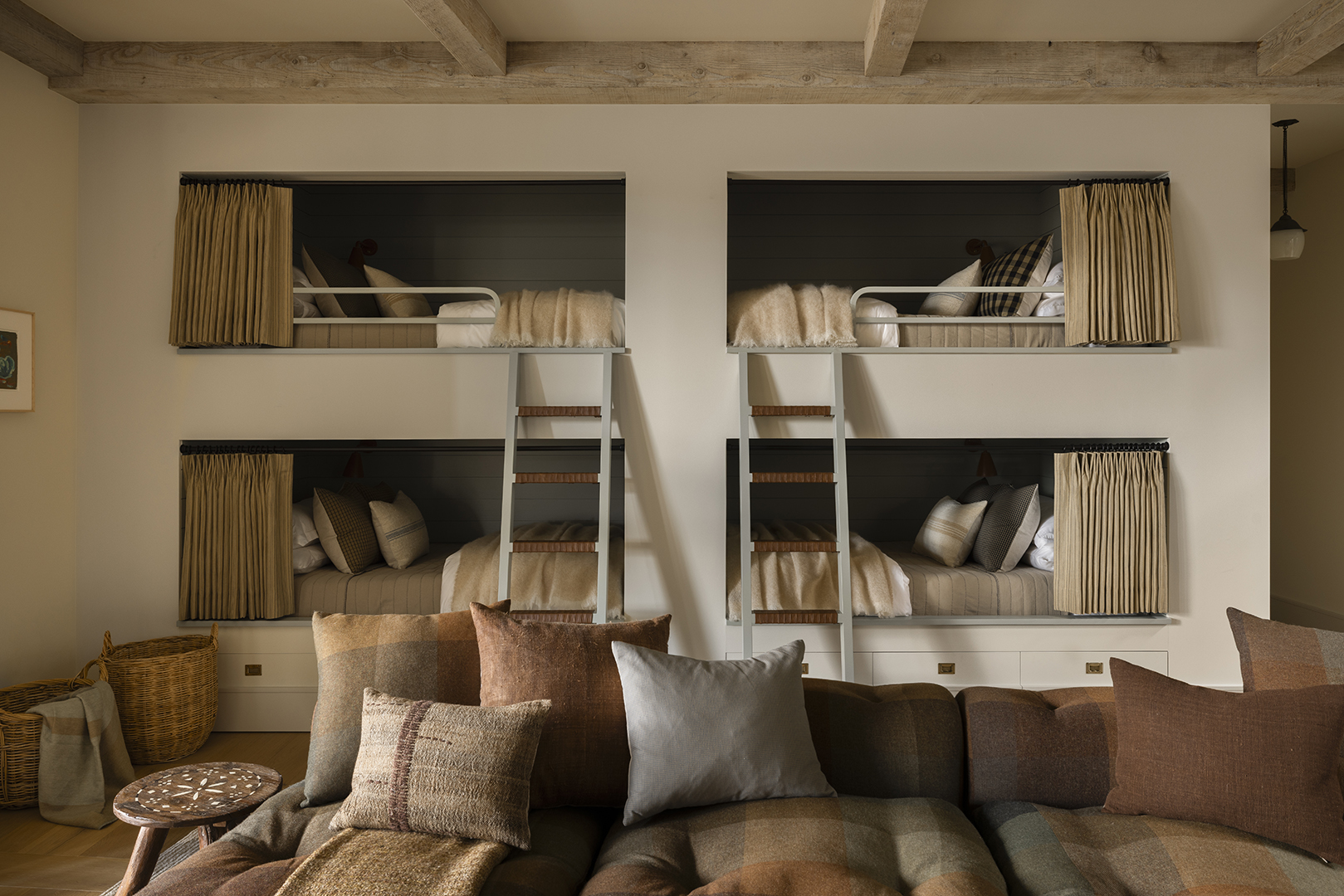 a wall of four built-in bunk beds