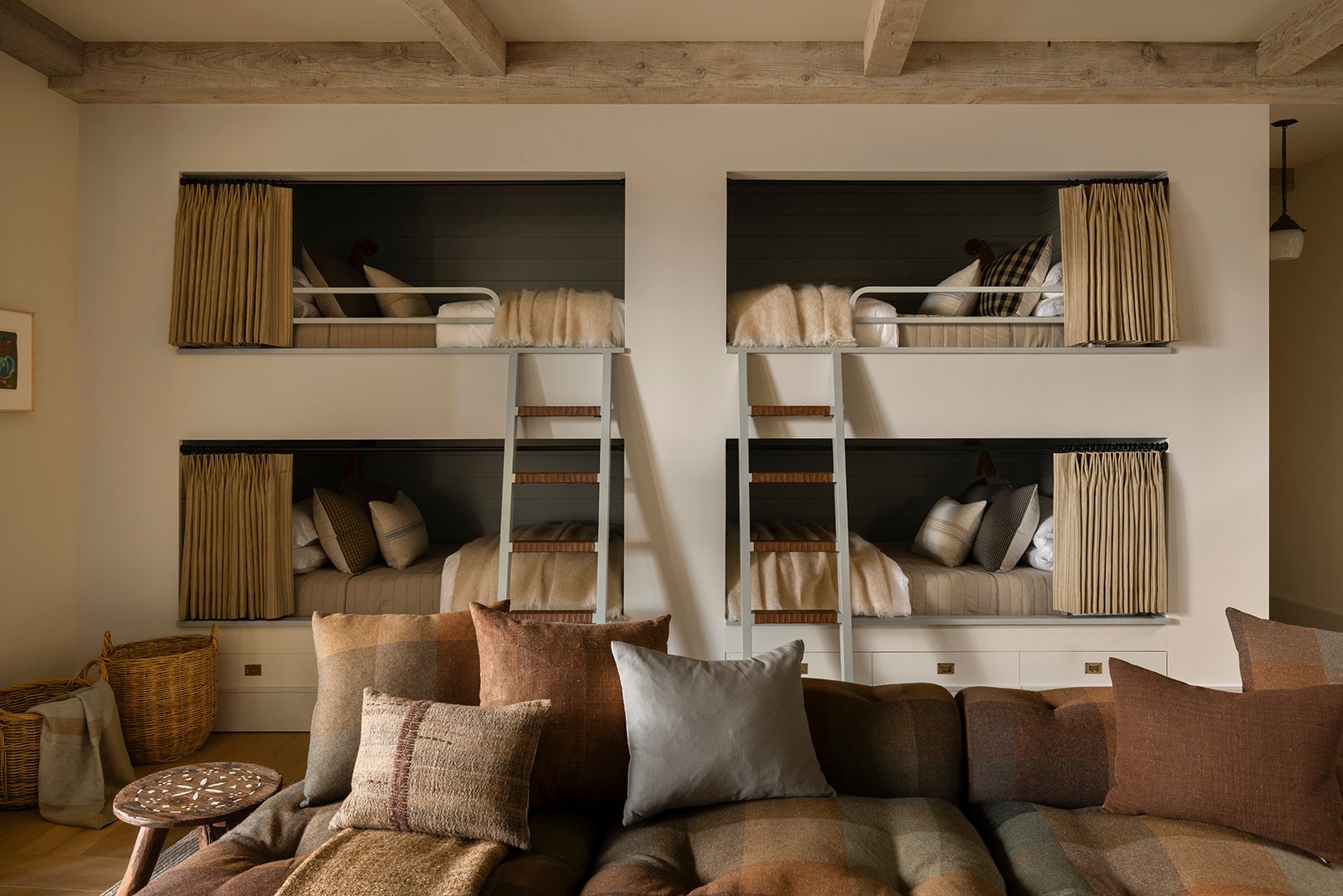 a wall of four built-in bunk beds