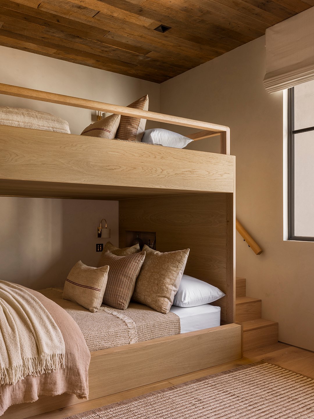 two neutral wooden bunk beds