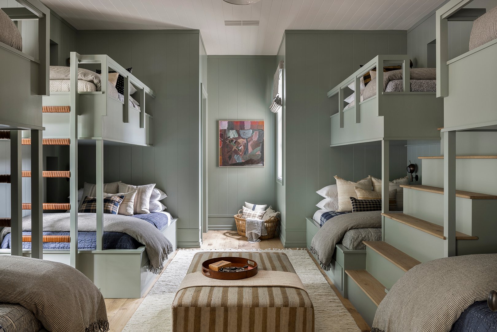 green bunk room with four beds