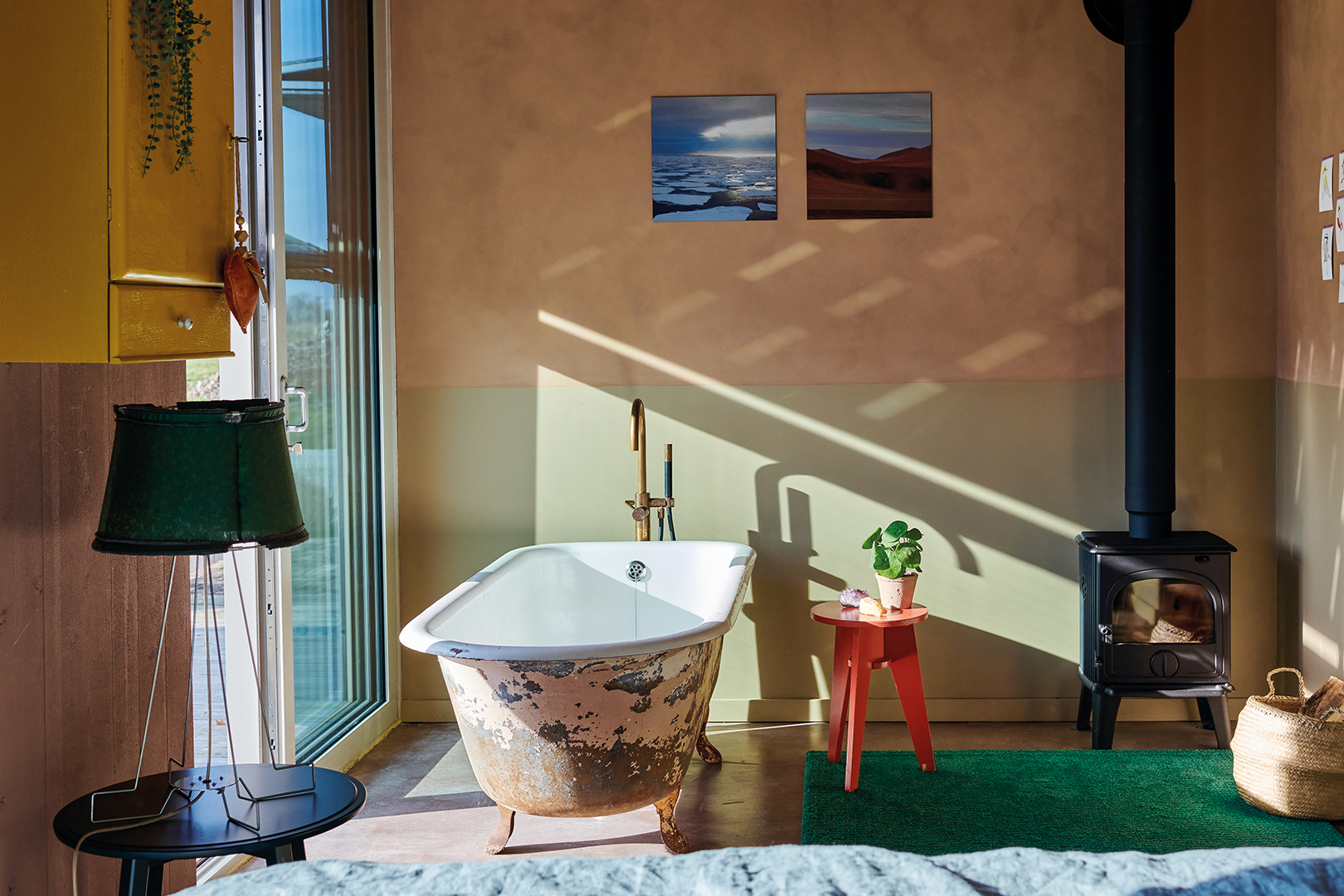 bathroom with plater walls and freestanding tub