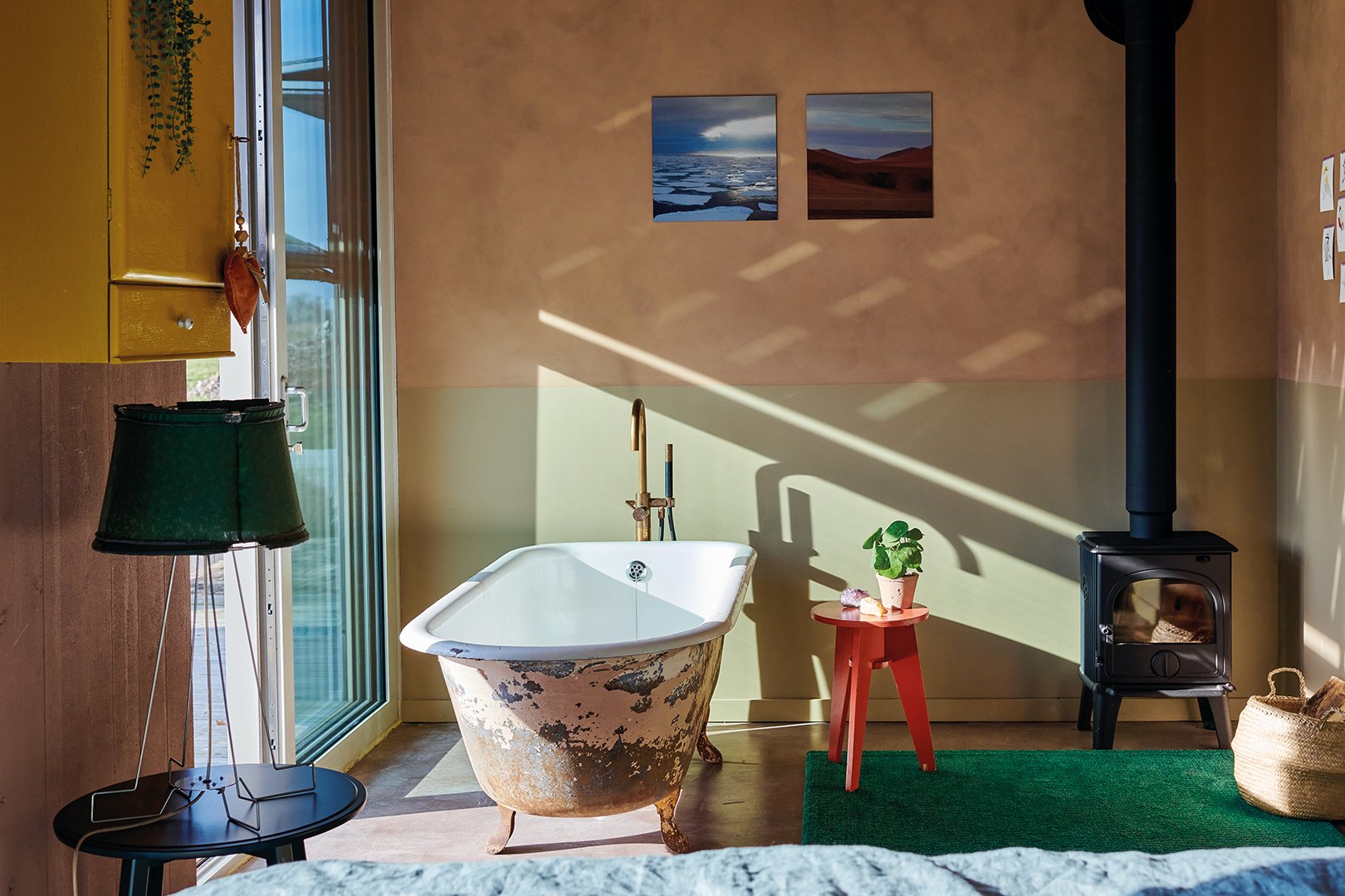 bathroom with plater walls and freestanding tub